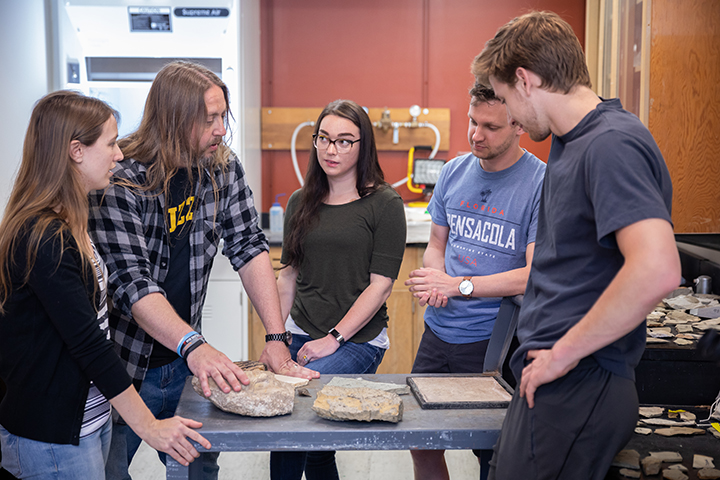 Pic of modern-day students looking at specimens