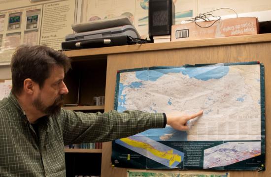 Eric Sandvol, a professor of geological sciences at the University of Missouri, points on a map of the country of Turkey where a team of scientists from MU, Georgia Tech and the Scientific and Technological Research Institution of Turkey (TUBITAK) will place 250 seismometers called nodes in and around the area of the East Anatolian fault sometime in late April 2023. Pate McCuien/University of Missouri
